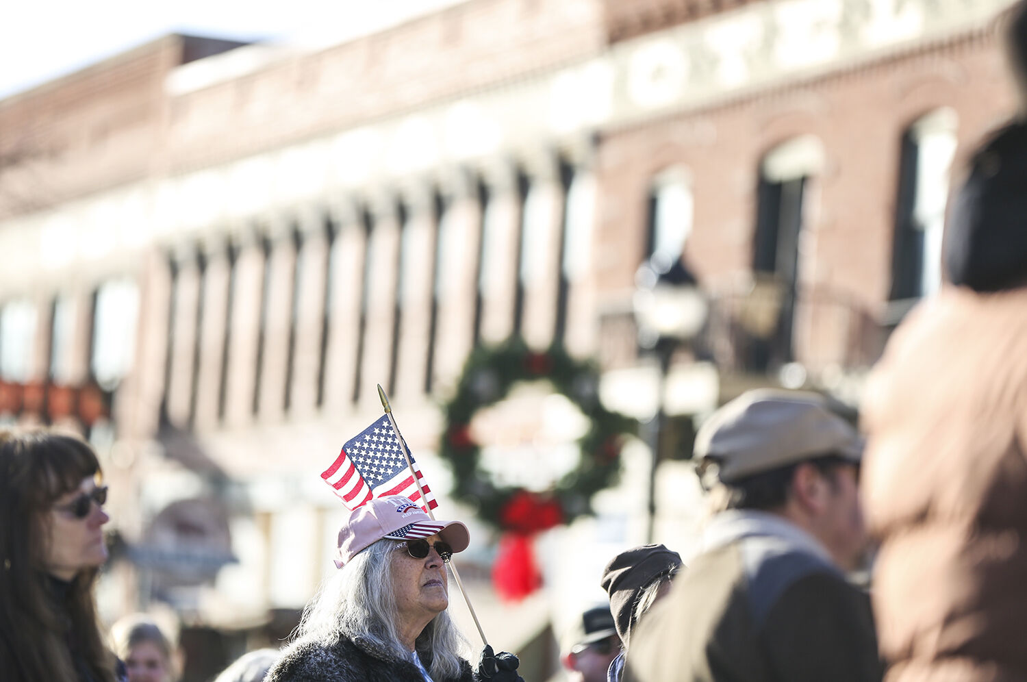 Sandy Denton boasts a small American flag above her head
